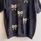 Adorable 1990s Black Short Sleeve Sweater With Gold Bows (M/L)