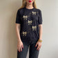 Adorable 1990s Black Short Sleeve Sweater With Gold Bows (M/L)