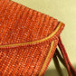 1970s Brown Raffia Clutch With Gold Trim